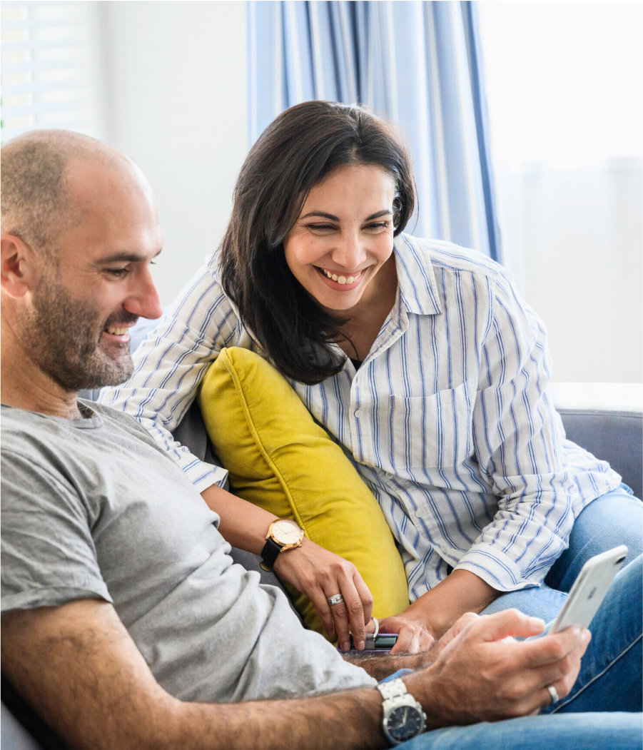 Couple checking their Milford KiwiSaver balance